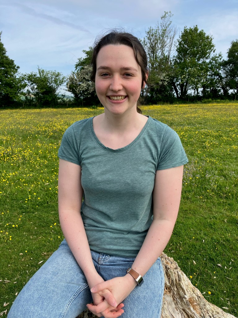 Annabel Nicholls in a meadow.
