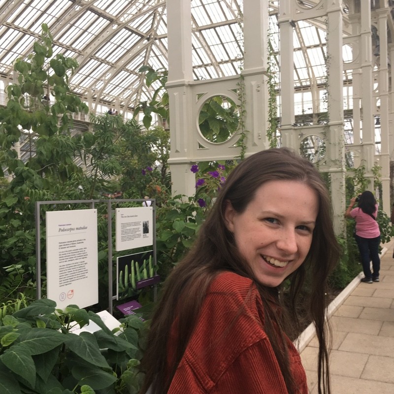 Ellie Defty in a botanic garden greenhouse.